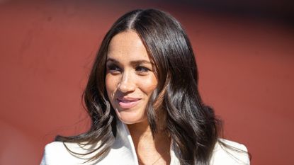 Meghan Markle and Fergie, Meghan, Duchess of Sussex attends the athletics on day two of the Invictus Games 2020 at Zuiderpark on April 17, 2022 in The Hague, Netherlands.