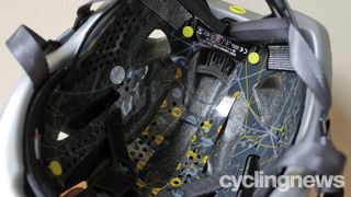 The inside of the Scott Cadence Plus helmet, showing the black and yellow MIPS liner
