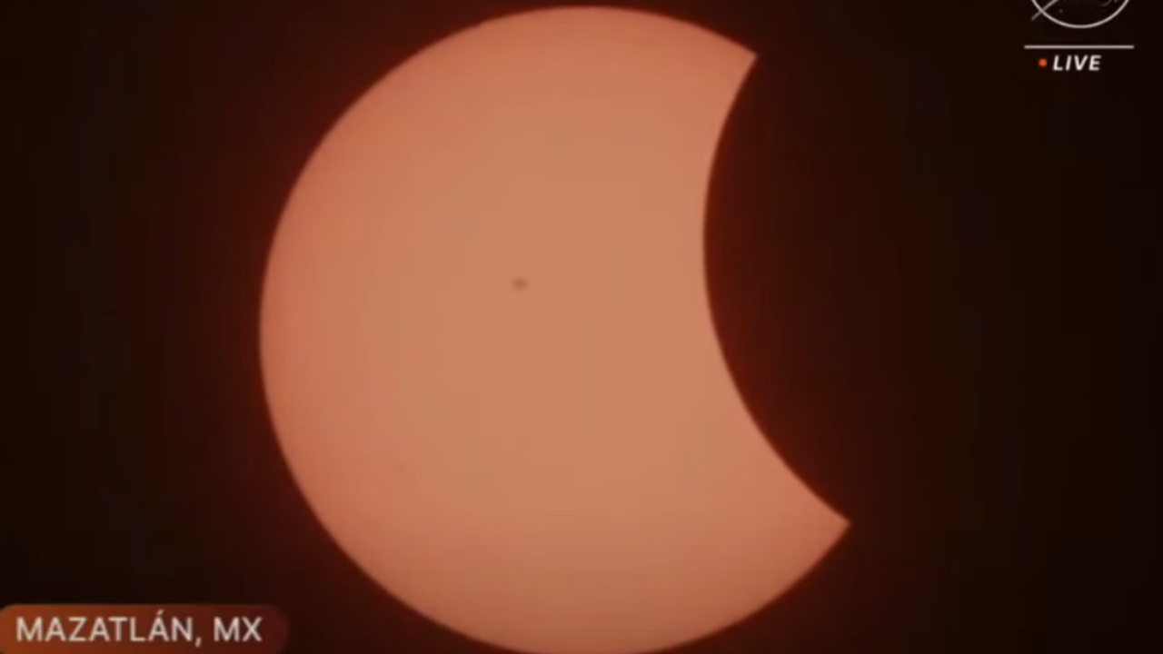 The moon begins moving in front of the sun in Mazatlan Mexico