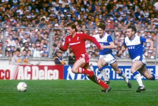 Kenny Dalglish runs with the ball while playing for Liverpool against Everton in the 1986 FA Cup final