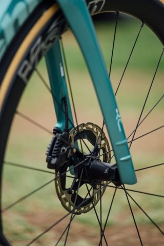 The front forks of an Arkea Bianchi Oltre in celeste green