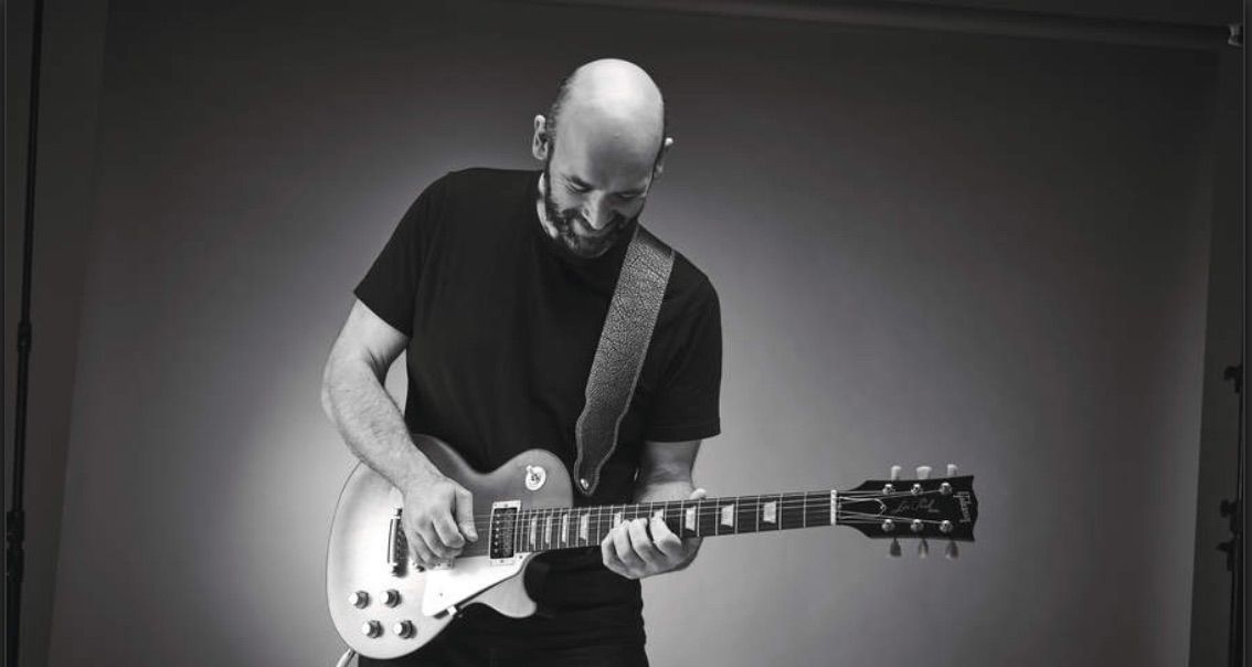 A guitarist plays a Gibson Les Paul