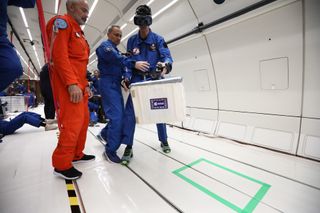 European Space Agency researchers experimenting with virtual reality during a parabolic flight simulating lunar gravity.
