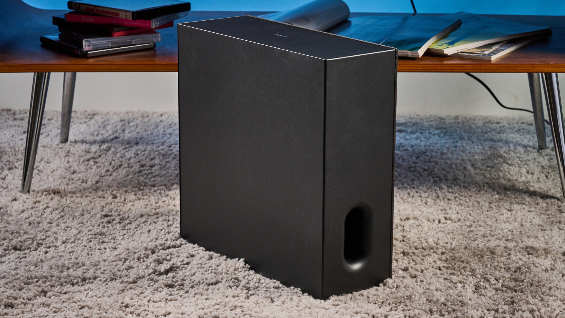 the sony bravia theater bar 7 photographed with the subwoofer with a TV on the tom's guide blue background