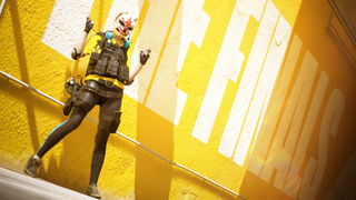A character from The Finals poses in front of a wall with "THE FINALS" written on it.