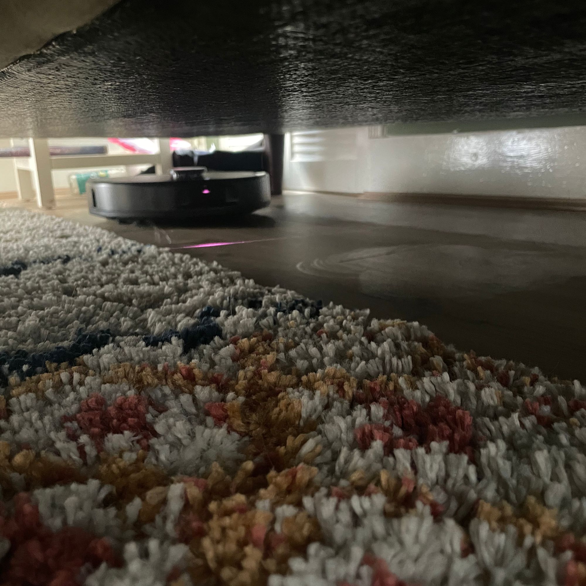 Roborock QV 35S Robot Vacuum With Mop cleaning underneath a sofa