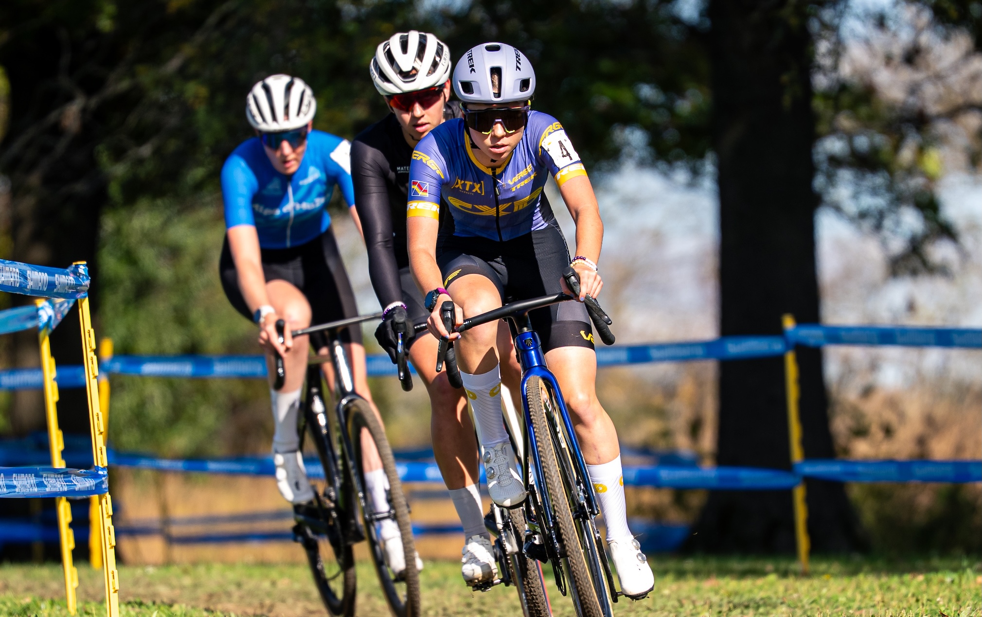 Manon Bakker rides behind CXD Trek Bikes teammates Ada Watson and Alyssa Sarkisov in elite women's race at Kings CX