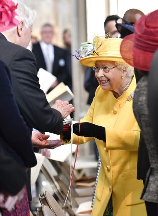 The Queen hands out Maundy Money at the ceremony