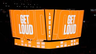 The new Daktronics centerhung display in orange telling fans to get loud. 