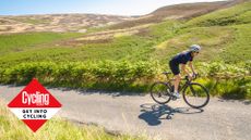 Image shows a cyclist riding outside.