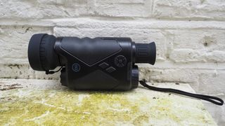 Bushnell Equinox Z2 6x50 Night Vision Monocular against a white wall