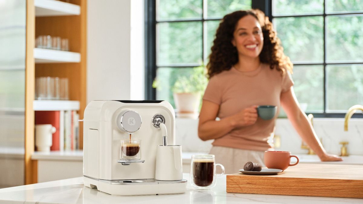 Woman drinking coffee made using Keurig Alta coffee maker