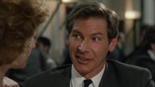 Harrison Ford smiling in Working Girl.