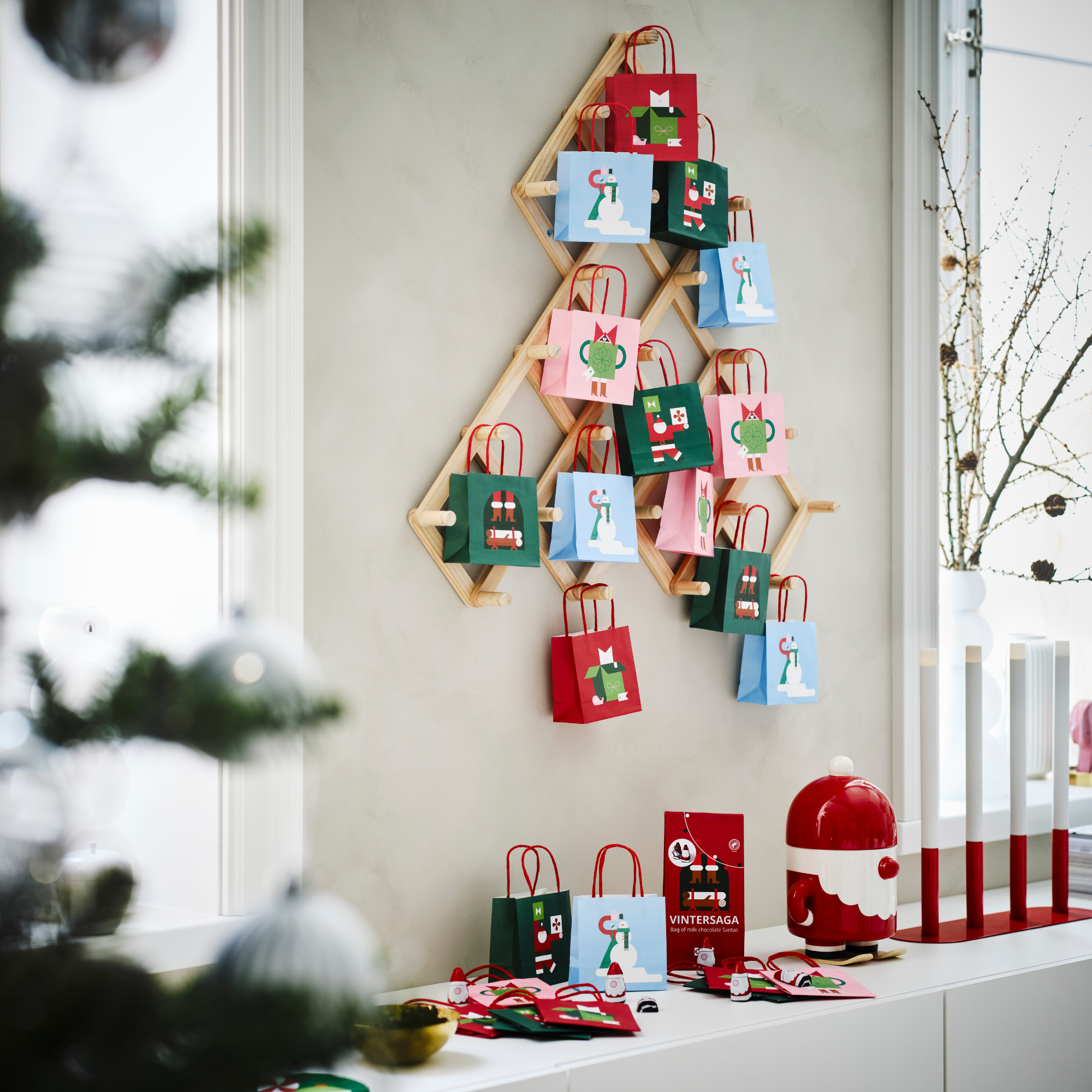IKEA VINTERFINT peg tree holding festive party bags.