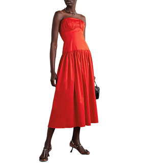 woman wearing a red bustier midi dress
