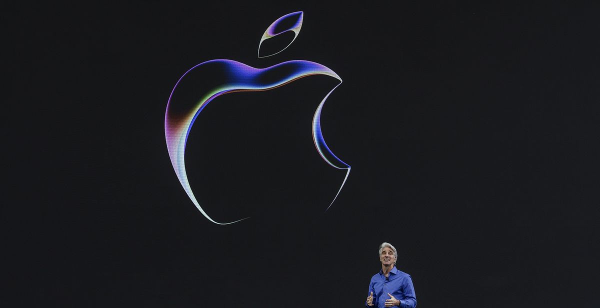 craig federighi standing beneath an apple logo at wwdc