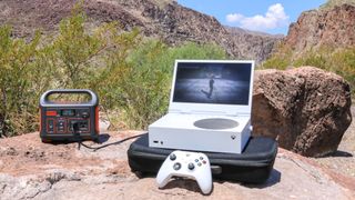 An Xbox Series S with an xScreen attached to it powered by a Jackery Explorer 300 portable power station