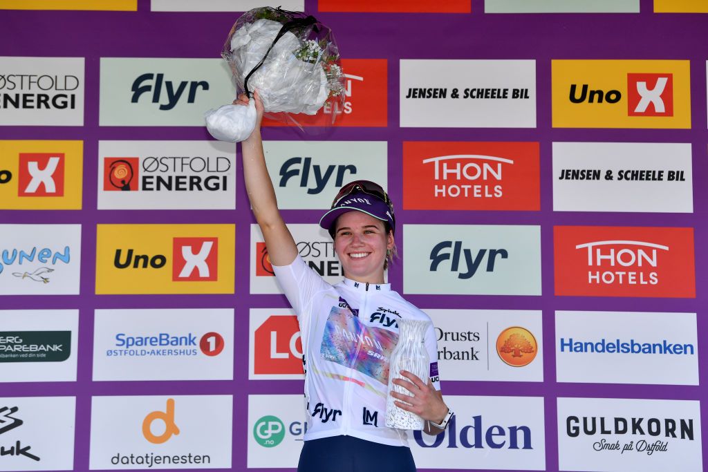 HALDEN NORWAY AUGUST 14 Neve Bradbury of Australia and Team CanyonSRAM Racing White Best Young Jersey celebrates at podium during the 8th Tour of Scandinavia 2022 Battle Of The North Stage 6 a 1543km stage from Lillestrm to Halden UCIWWT tourofscandinavia TOSC22 on August 14 2022 in Halden Norway Photo by Luc ClaessenGetty Images