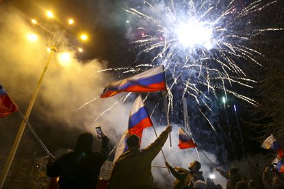 People celebrate Russia recognizing Donetsk as independent in eastern Ukraine