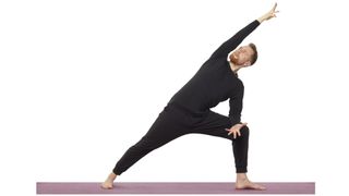 Yoga teacher Nick Higgins performs extended sidea angle