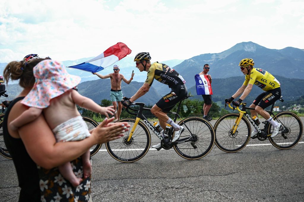 Jumbo-Visma's Dutch rider Wilco Kelderman (L) and Jumbo-Visma's Danish rider Jonas Vingegaard wearing the overall leader's yellow jersey cycle in ascent of the Col de la Ramaz during the 14th stage of the 110th edition of the Tour de France cycling race, 152 km between Annemasse and Morzine Les Portes du Soleil, in the French Alps, on July 15, 2023. (Photo by Anne-Christine POUJOULAT / AFP)