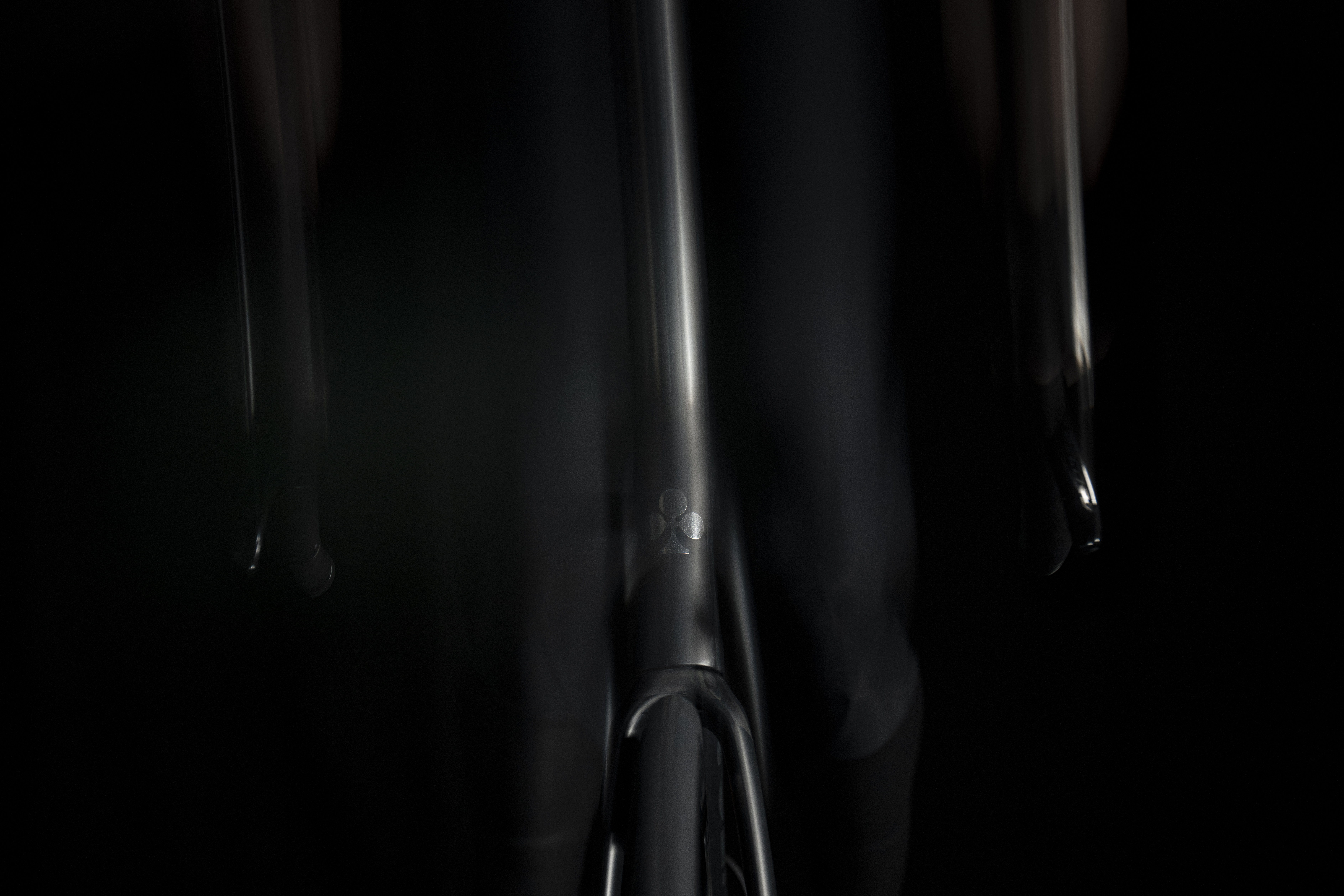 shadowy shots of a black Colnago bike on a black background