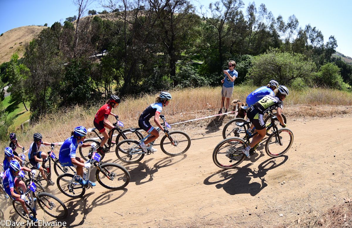 The riders were still tightly grouped during the fire road climb on lap four