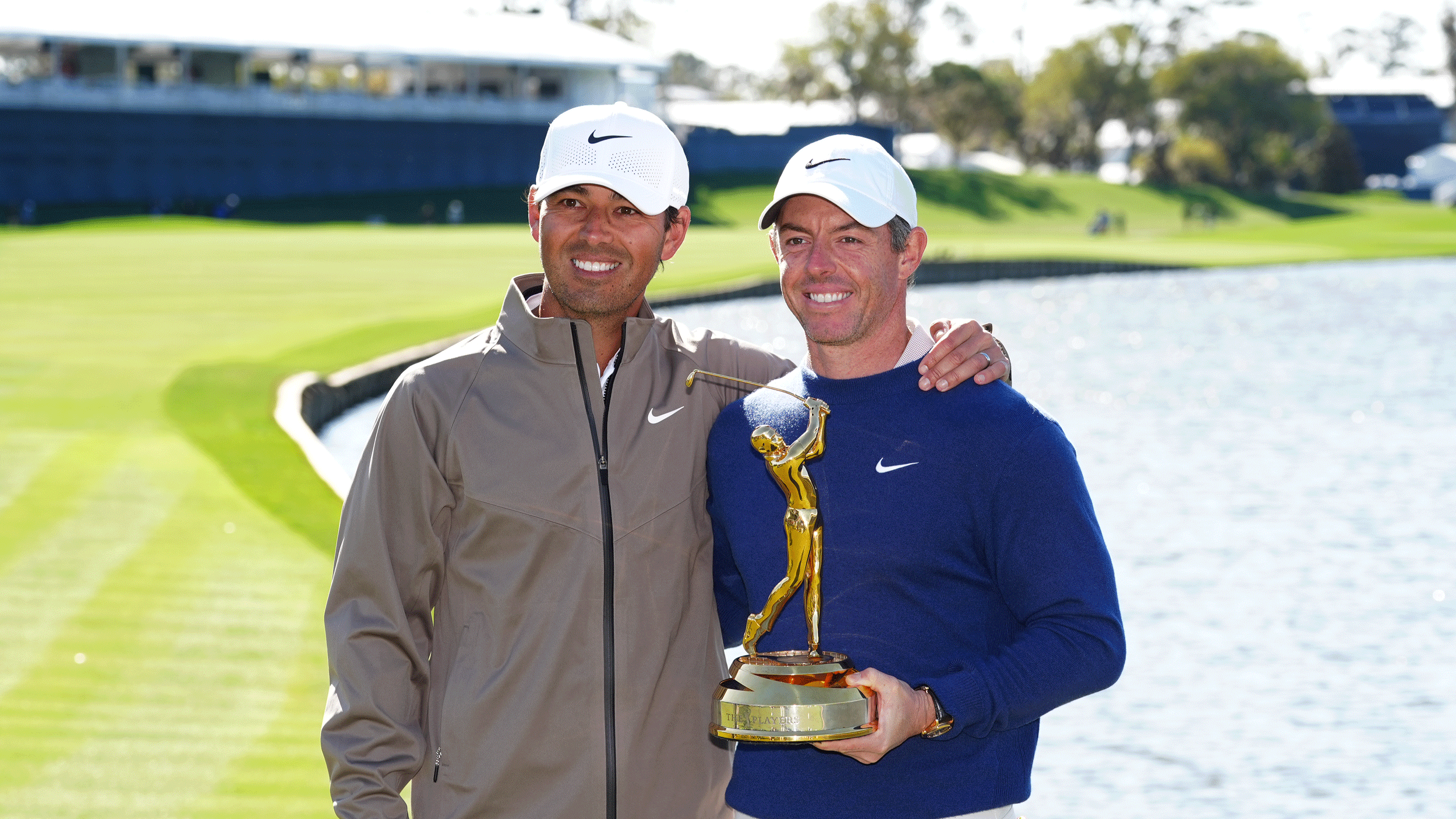 Harry Diamond (left) and Rory McIlroy poses with The Players Championship trophy after their win in 2025