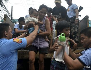 Human cost: evacuation underway in Albay Province