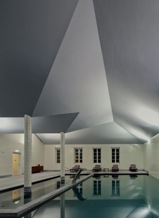 Modern swimming pool with a retro ceiling