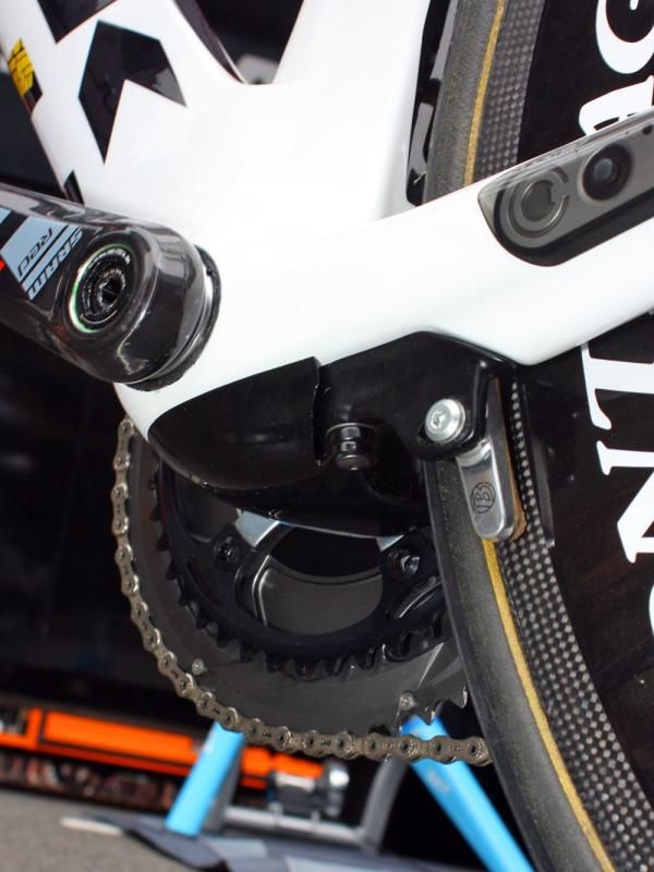 The proprietary rear brake arms are aerodynamically shielded by a small pod beneath the bottom bracket.