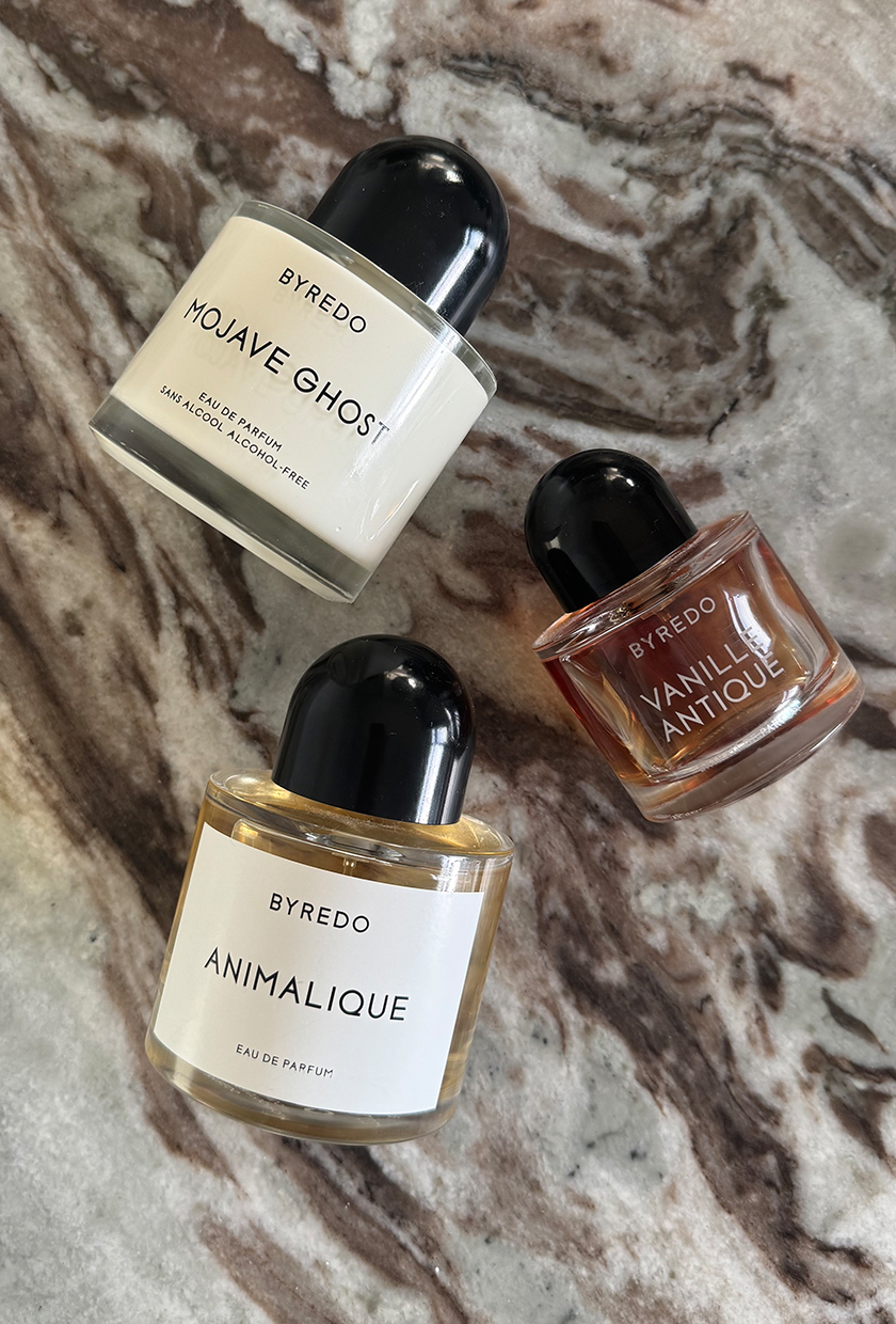 A photo of Byredo perfume bottles on a marbled table