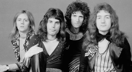 A classic black-and-white portrait of Queen: [left to right] Roger Taylor, Freddie Mercury, Brian May, John Deacon