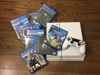 PlayStation 4 and pile of games