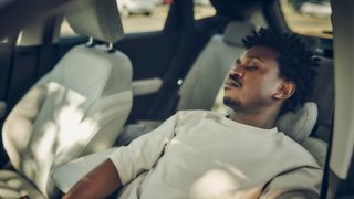 driver sleeping in Ford car seat