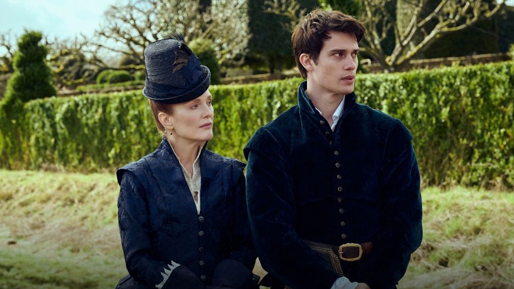 Julianne Moore as Mary Villiers and Nicholas Galitzine as George Villiers gazing into the distance in a promotional photo for Mary &amp; George