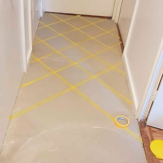hallway tape on flooring ready for painting