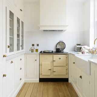 white kitchen with cupboard and worktop