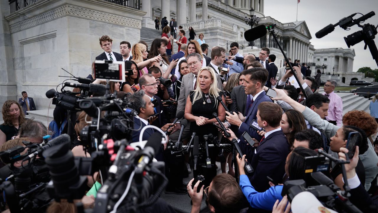 Rep. Marjorie Taylor Greene (R) surrounded by reporters after losing vote to oust House Speaker Mike Johnson (R).