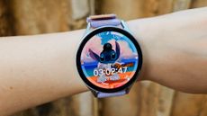 The Photos watch face on the Samsung Galaxy Watch 7 with an animated Stitch background