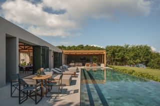 quinta del sol mexican house with lots of verdant outdoor areas and timber ceilings