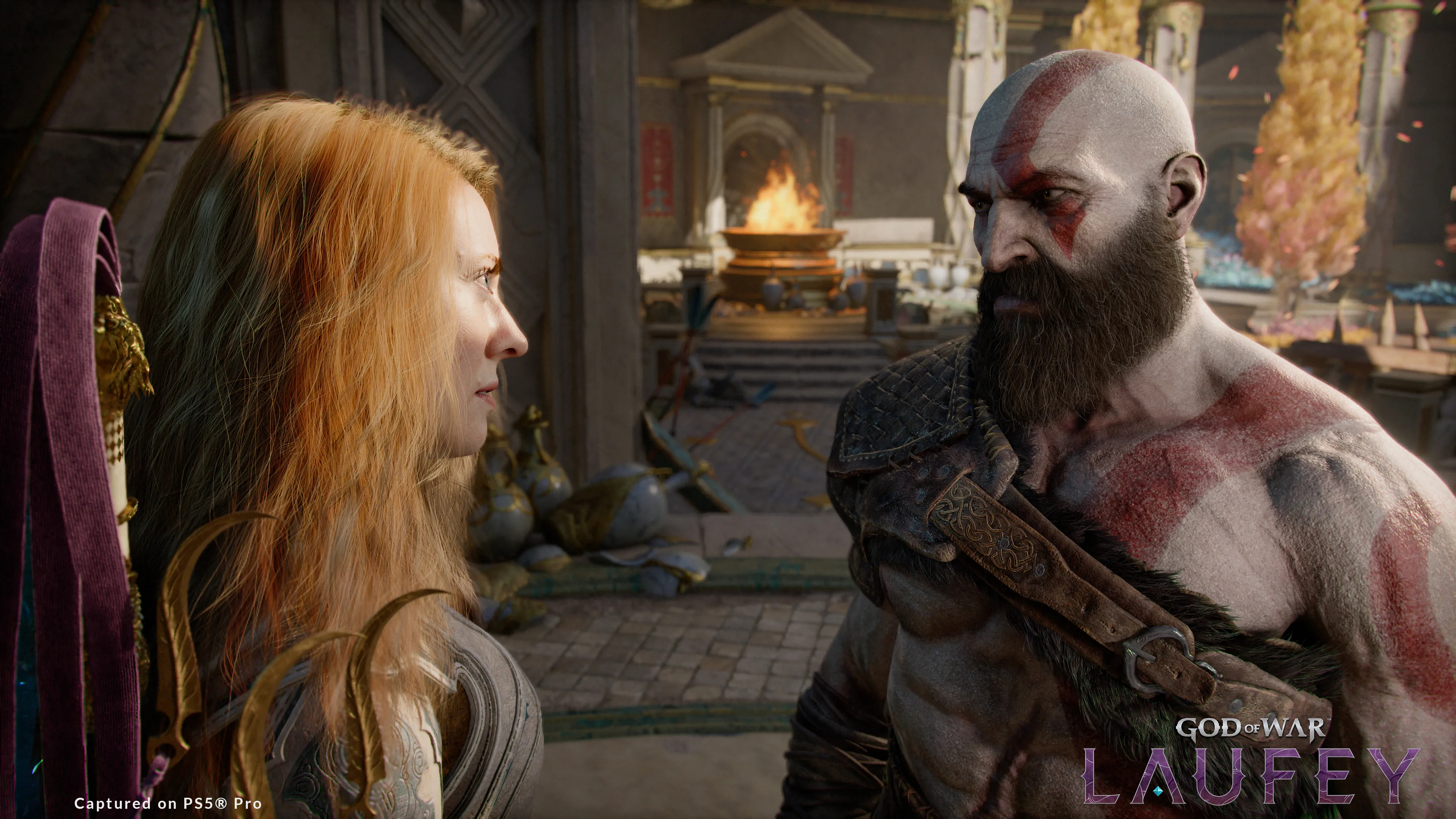A screenshot from God of War Laufey showing Laufey and Kratos in an ancient Greek setting