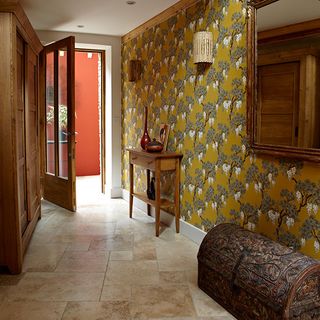hallway with floral wallpaper