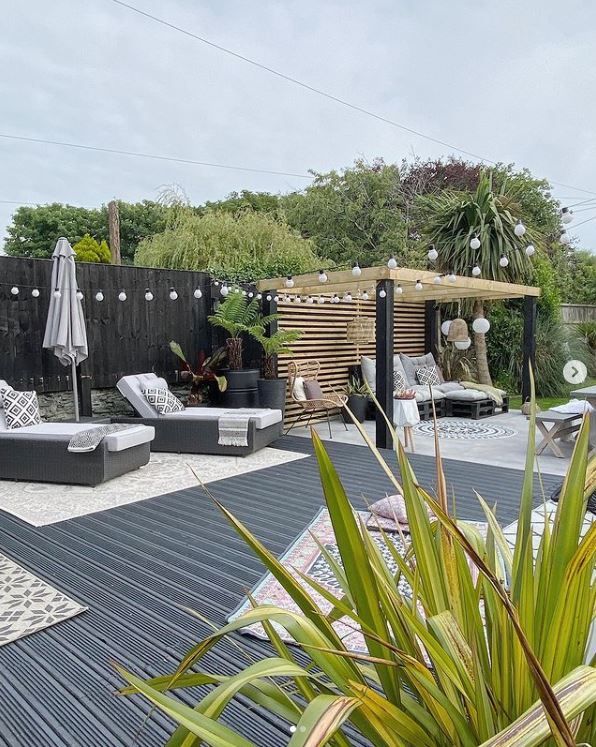 Black decking with sun loungers