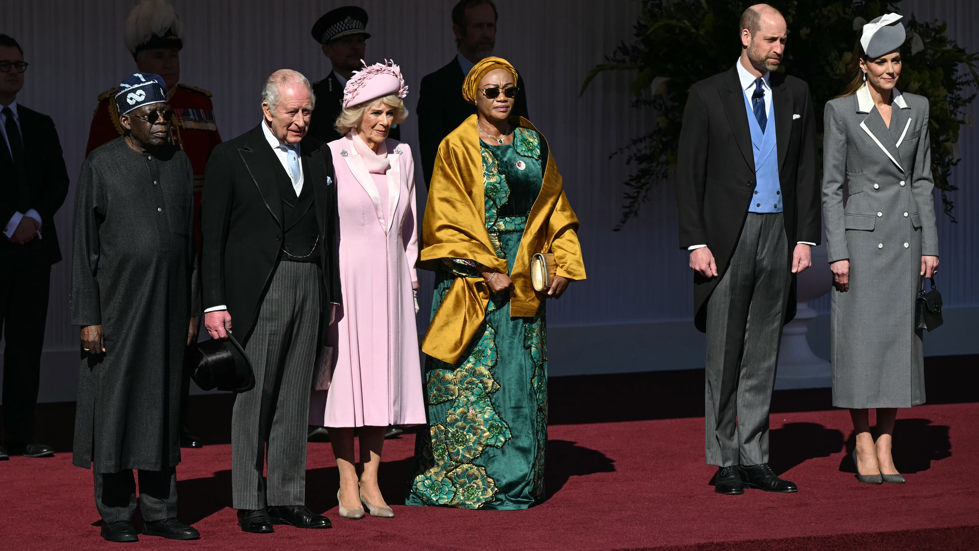 King Charles III and Queen Camilla stand with Nigeria's President Bola Tinubu and Nigeria's First Lady Oluremi Tinubu, as well as Prince William, Prince of Wales and Catherine, Princess of Wales as they listen to national anthems during a formal welcome