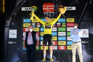 GAP FRANCE JUNE 10 Wout Van Aert of Belgium and Team Jumbo Visma celebrates winning the Yellow Leader Jersey on the podium ceremony after the 74th Criterium du Dauphine 2022 Stage 6 a 1964km stage from Rives to Gap 742m WorldTour Dauphin on June 10 2022 in Gap France Photo by Dario BelingheriGetty Images