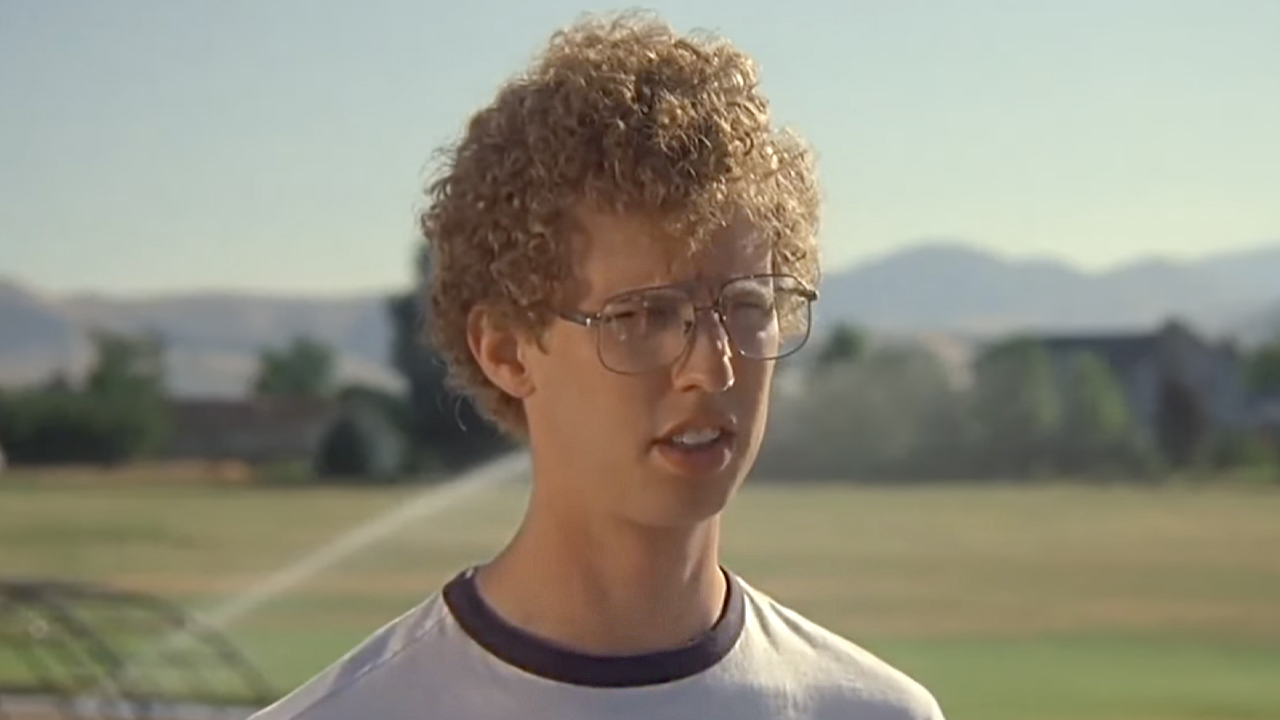 Napoleon stands in front of the playground and the tetherball court, ready to profess his love to Deb with a "delicious Bass."