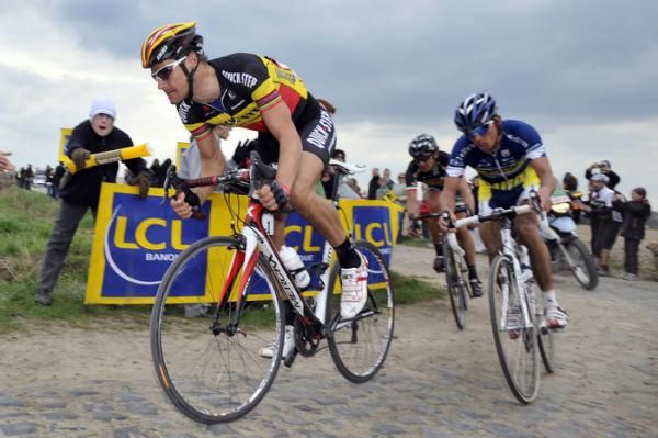 Tom Boonen (Quick Step) sprints around a corner ahead of Bjorn Leukemans (Vacansoleil)