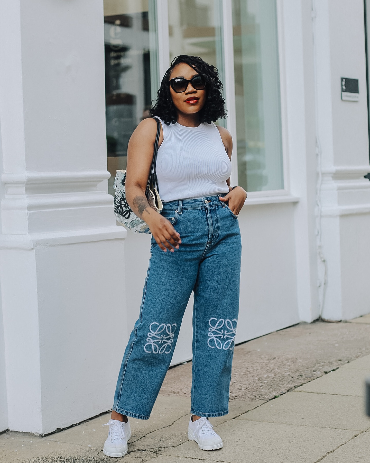 woman with short hair posing on the street
