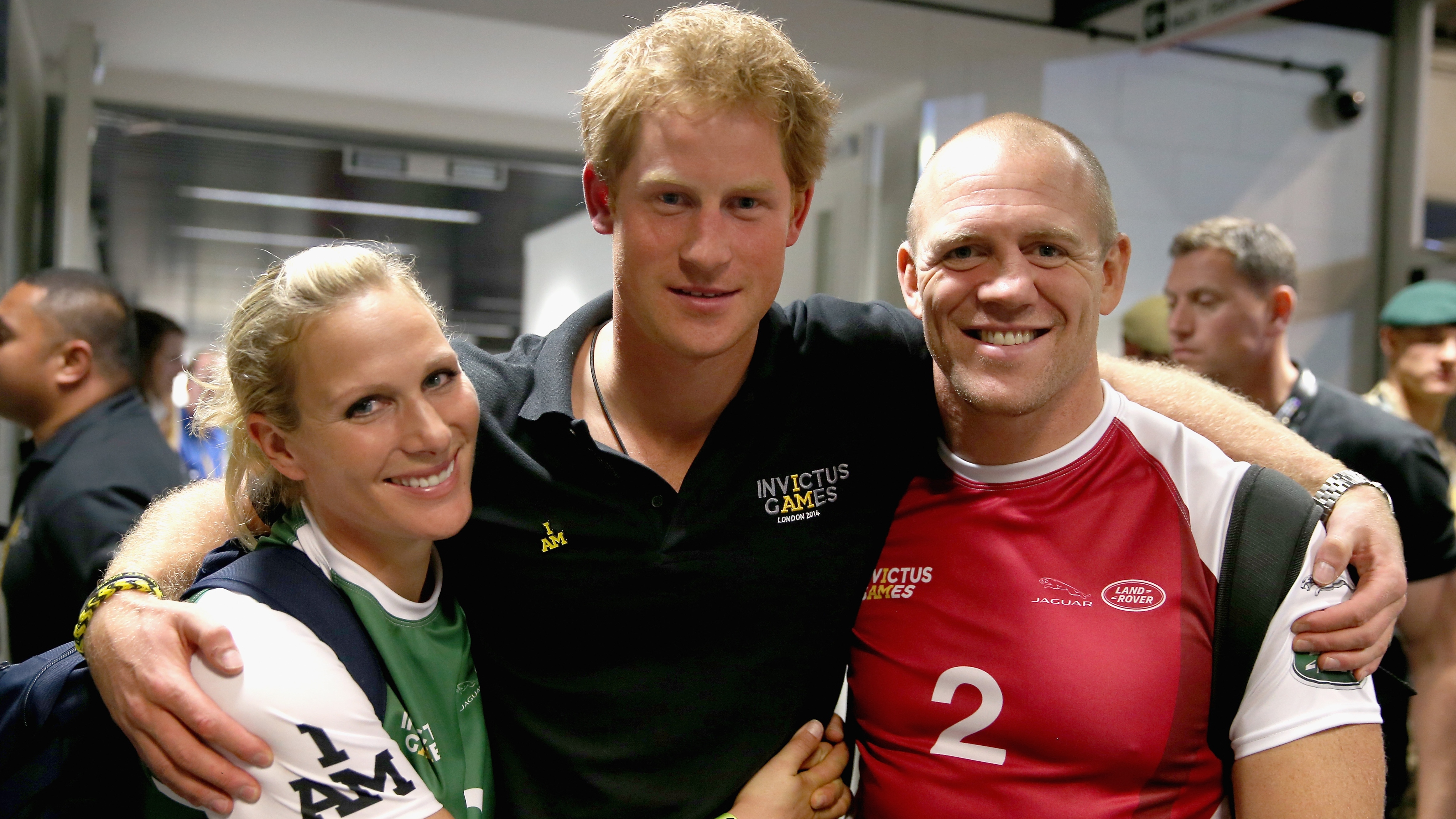 Prince Harry, Zara and Mike Tindall pose for a photograph after competing in an Exhibition wheelchair rugby match on September 12, 2014